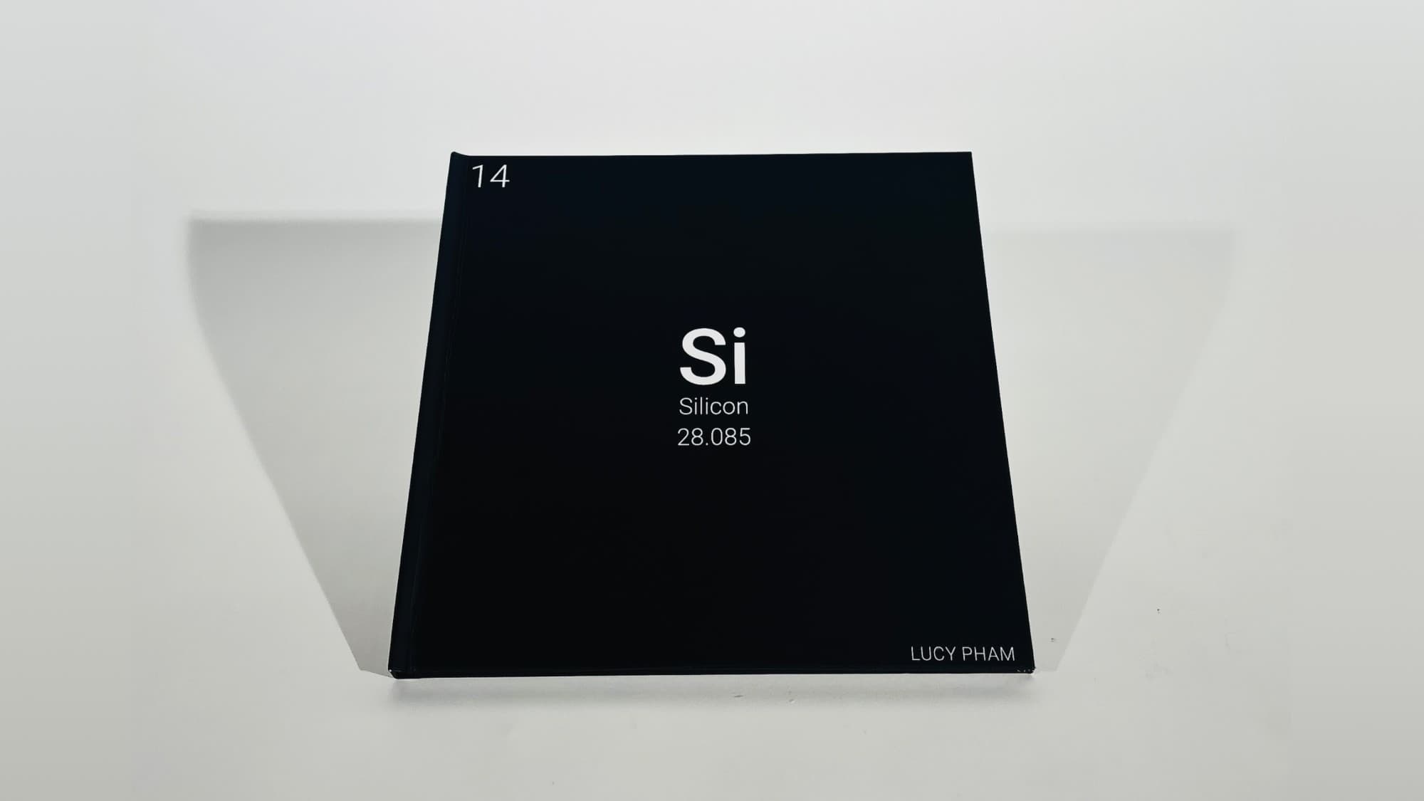 The printed cover of Si: Silicon, styled as the element's periodic table cell